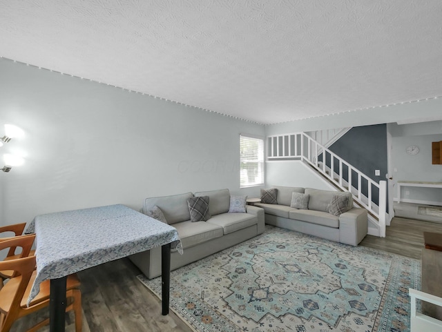 4809 King Albert Dr Unit 1A, Hilliard, OH 43026 - living room with wood finished floors, a textured ceiling, and stairway
