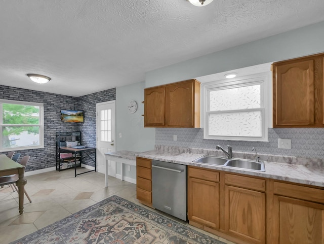 4809 King Albert Dr Unit 1A, Hilliard, OH 43026 - kitchen with dishwasher, light countertops, a textured ceiling, decorative backsplash, and brown cabinets