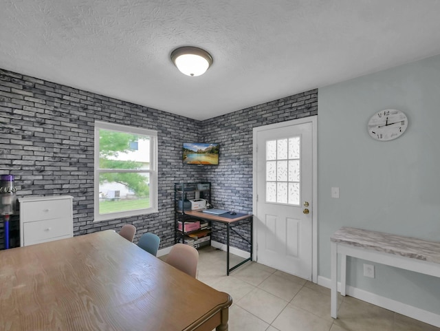 4809 King Albert Dr Unit 1A, Hilliard, OH 43026 - office space with brick wall, plenty of natural light, light tile patterned flooring, and a textured ceiling