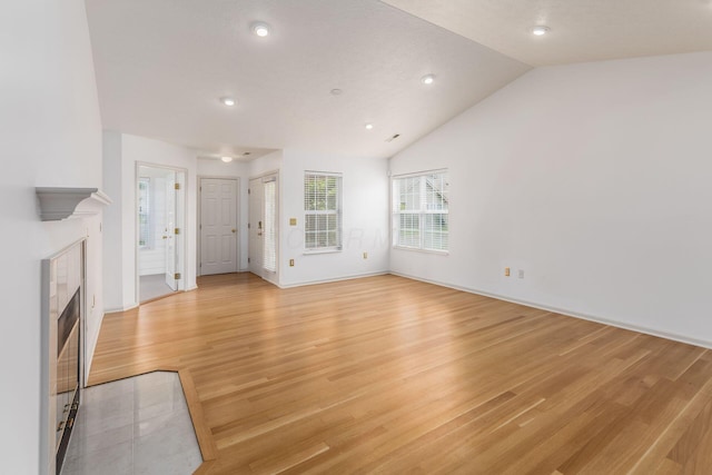 8209 Farm Crossing Cir, Powell, OH 43065 - unfurnished living room with a fireplace, light wood finished floors, lofted ceiling, and recessed lighting