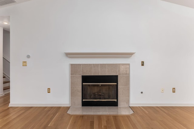 8209 Farm Crossing Cir, Powell, OH 43065 - detailed view of wood finished floors and a tiled fireplace