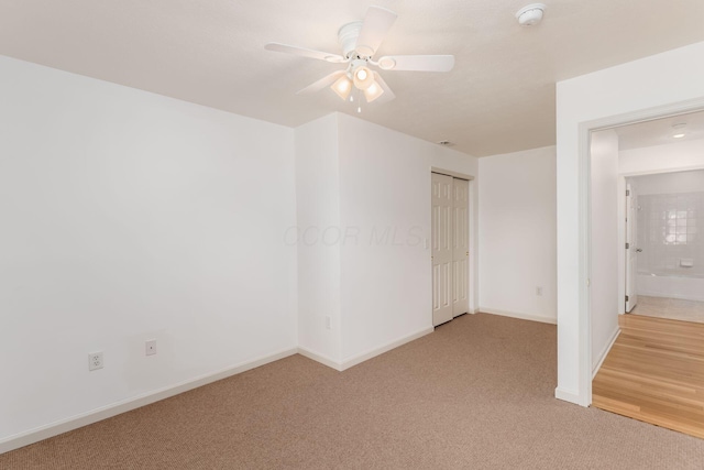 8209 Farm Crossing Cir, Powell, OH 43065 - unfurnished bedroom featuring light carpet, ceiling fan, and a closet
