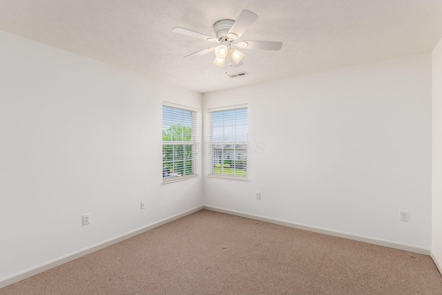 8209 Farm Crossing Cir, Powell, OH 43065 - spare room with light carpet, ceiling fan, and a textured ceiling