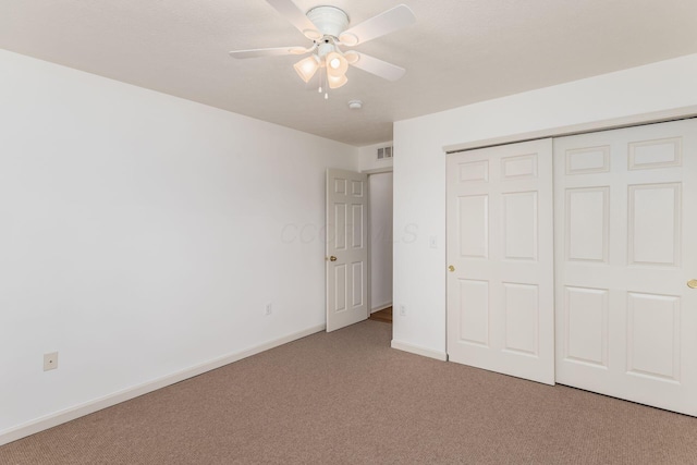 8209 Farm Crossing Cir, Powell, OH 43065 - unfurnished bedroom featuring carpet floors, a closet, and a ceiling fan