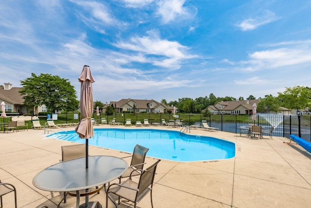 8209 Farm Crossing Cir, Powell, OH 43065 - community pool featuring a patio and a residential view