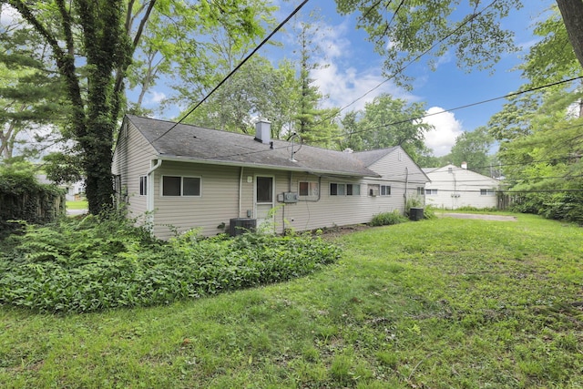 934-936 Kramer Ave, Columbus, OH 43212 - rear view of house with a chimney, a lawn, and roof with shingles