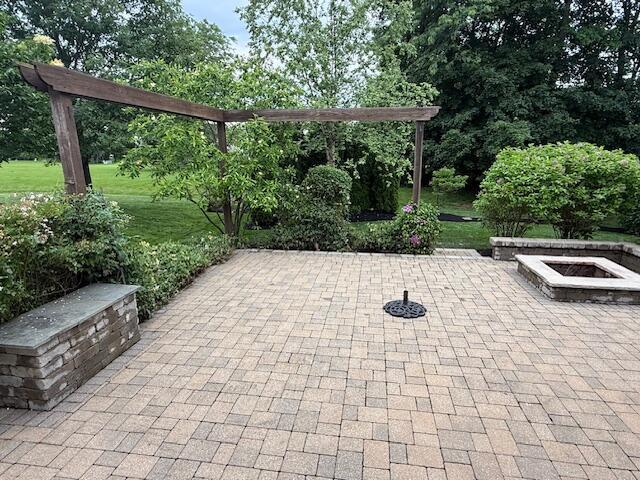 8020 Glenmore Dr, Powell, OH 43065 - view of patio featuring an outdoor fire pit