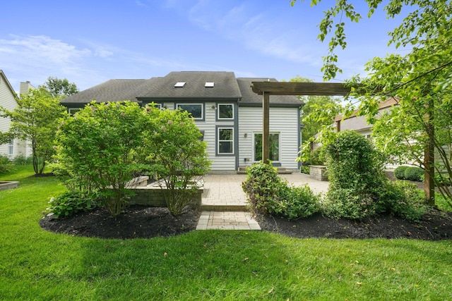 8020 Glenmore Dr, Powell, OH 43065 - back of house featuring a patio area, a lawn, and roof with shingles