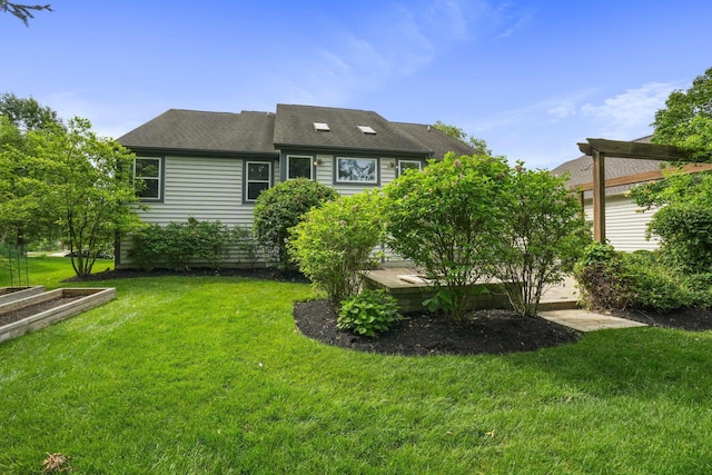 8020 Glenmore Dr, Powell, OH 43065 - rear view of property featuring a lawn and roof with shingles