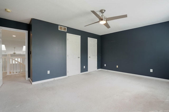 8020 Glenmore Dr, Powell, OH 43065 - unfurnished bedroom with carpet, two closets, and a ceiling fan