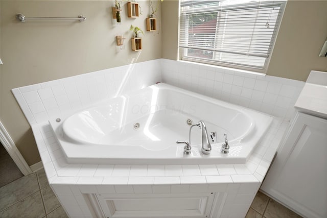 8020 Glenmore Dr, Powell, OH 43065 - bathroom with vanity, a tub with jets, and tile patterned flooring