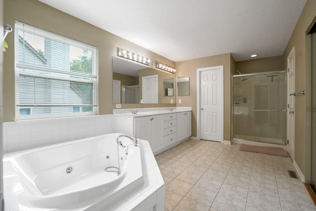 8020 Glenmore Dr, Powell, OH 43065 - bathroom with a stall shower, double vanity, a tub with jets, and tile patterned floors