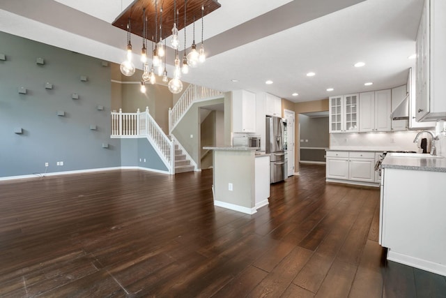 8020 Glenmore Dr, Powell, OH 43065 - kitchen featuring stainless steel fridge with ice dispenser, dark wood-style flooring, white cabinetry, glass insert cabinets, and light countertops