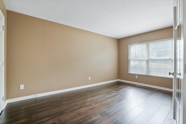 8020 Glenmore Dr, Powell, OH 43065 - spare room featuring dark wood-style flooring and baseboards