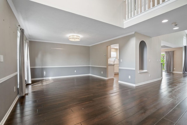 8020 Glenmore Dr, Powell, OH 43065 - unfurnished living room with dark wood-style floors, ornamental molding, and recessed lighting