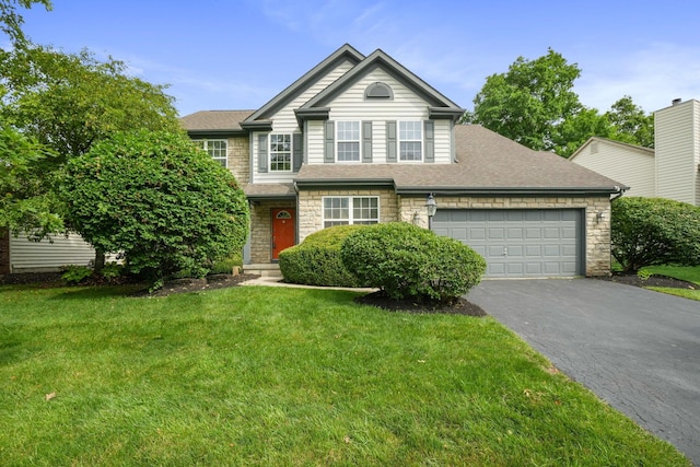 8020 Glenmore Dr, Powell, OH 43065 - view of front of home featuring stone siding, driveway, a garage, and a front yard