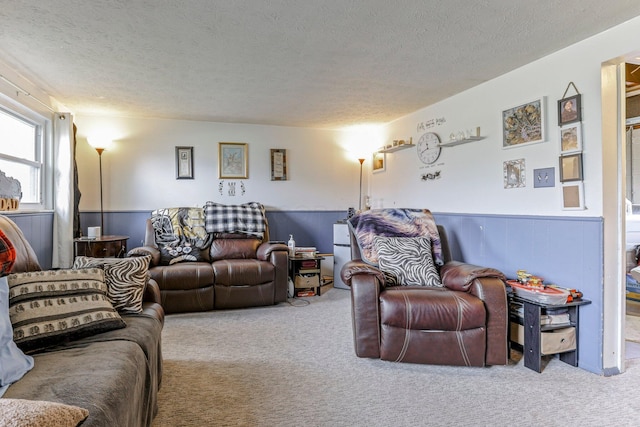718 Bradwell Dr, Columbus, OH 43207 - carpeted living area featuring a textured ceiling and a wainscoted wall