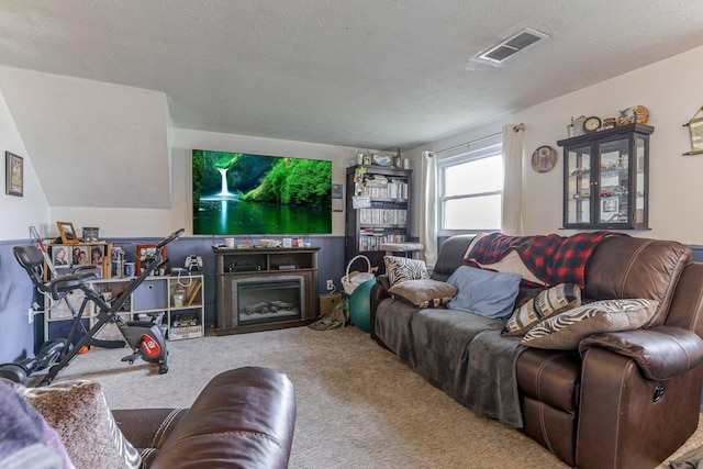 718 Bradwell Dr, Columbus, OH 43207 - living room with carpet floors and a textured ceiling