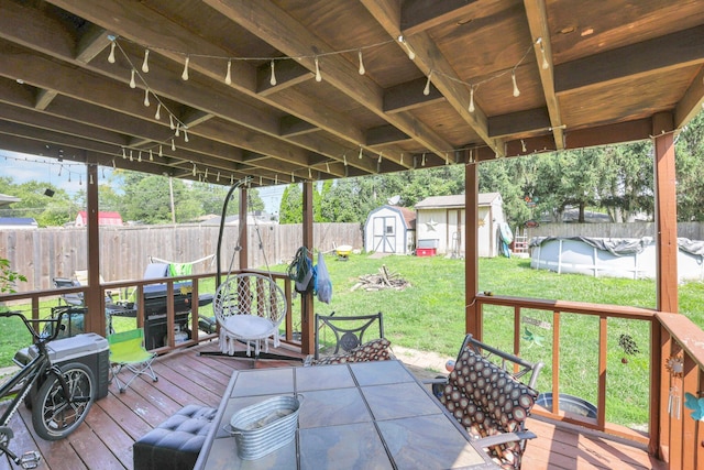 718 Bradwell Dr, Columbus, OH 43207 - wooden terrace with a shed, outdoor dining space, and a fenced backyard