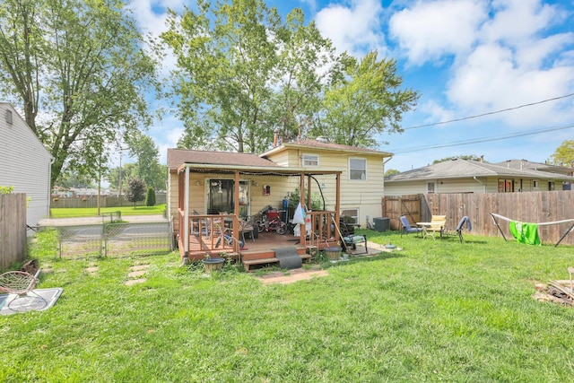 718 Bradwell Dr, Columbus, OH 43207 - rear view of house featuring a fenced backyard and a deck