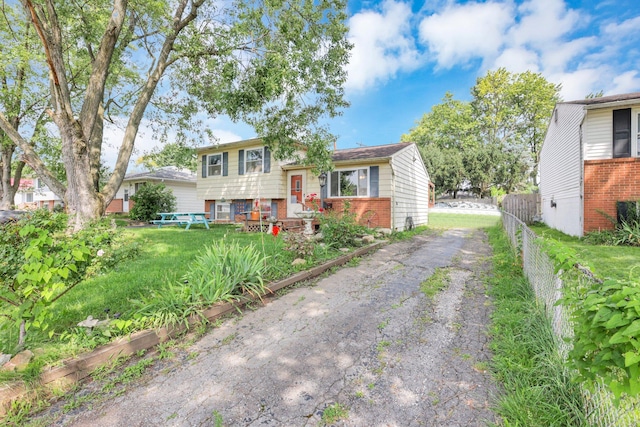 718 Bradwell Dr, Columbus, OH 43207 - split level home featuring brick siding and driveway