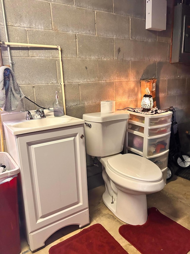 718 Bradwell Dr, Columbus, OH 43207 - half bath with concrete block wall, vanity, and electric panel