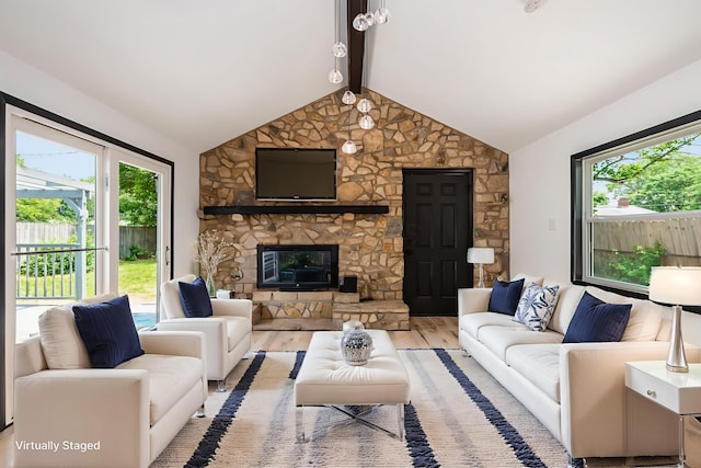 340 Danhurst Rd, Columbus, OH 43228 - living area featuring wood finished floors, plenty of natural light, and a stone fireplace