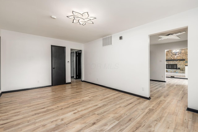 340 Danhurst Rd, Columbus, OH 43228 - unfurnished room with light wood finished floors, a fireplace, and a smoke detector