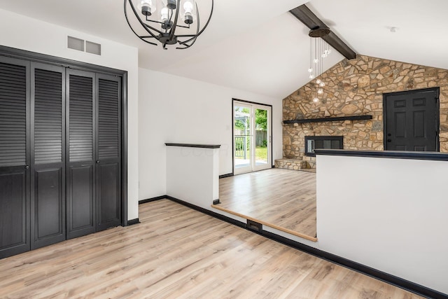 340 Danhurst Rd, Columbus, OH 43228 - kitchen with wood finished floors, a chandelier, a fireplace, and open floor plan