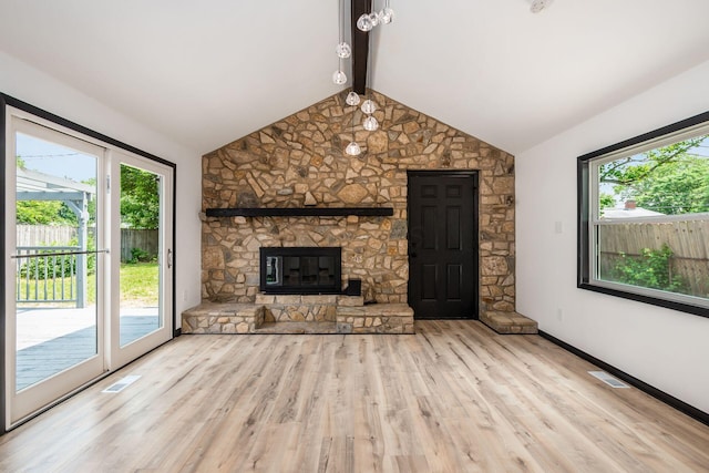 340 Danhurst Rd, Columbus, OH 43228 - unfurnished living room featuring healthy amount of natural light, wood finished floors, and a stone fireplace