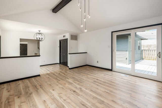 340 Danhurst Rd, Columbus, OH 43228 - unfurnished living room with a chandelier and wood finished floors