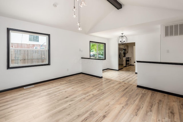 340 Danhurst Rd, Columbus, OH 43228 - spare room featuring a chandelier, light wood-type flooring, and a smoke detector