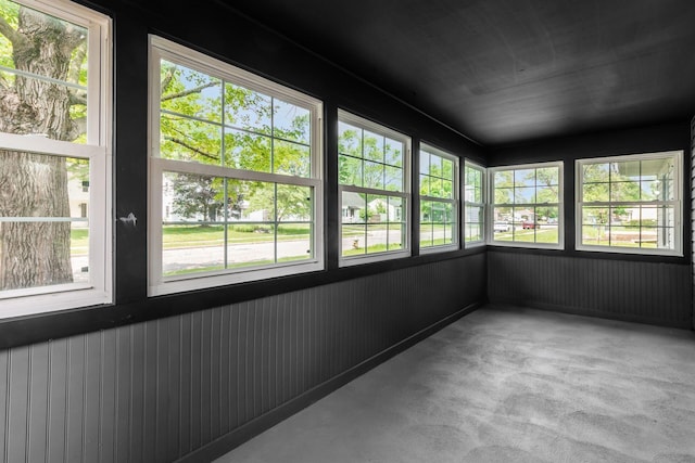 340 Danhurst Rd, Columbus, OH 43228 - unfurnished sunroom featuring plenty of natural light and wood walls