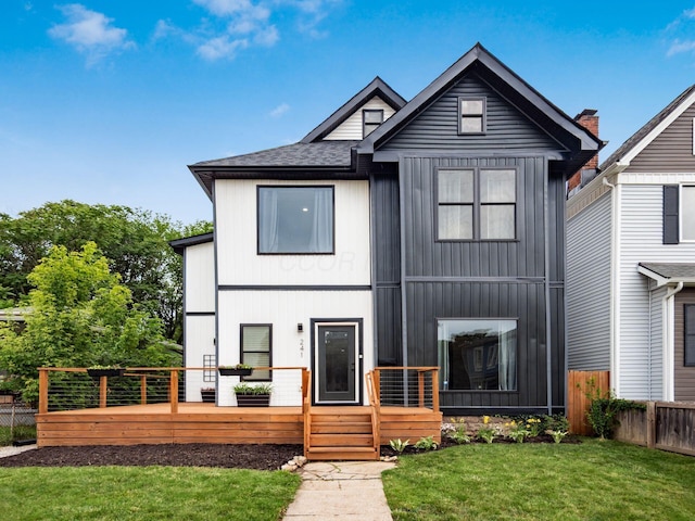 241 N 17th St, Columbus, OH 43203 - view of front of home with board and batten siding, a wooden deck, and roof with shingles