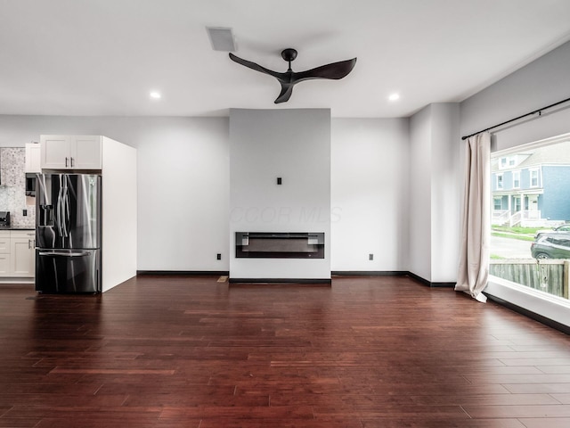 241 N 17th St, Columbus, OH 43203 - unfurnished living room featuring a ceiling fan, recessed lighting, and dark wood-style flooring