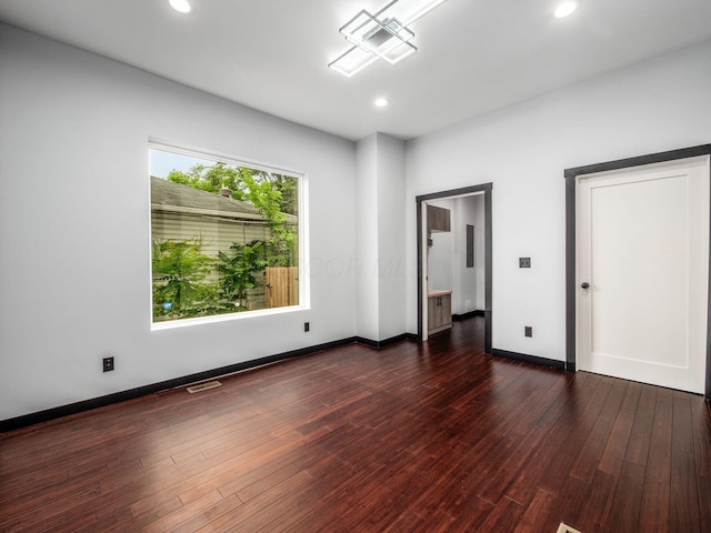 241 N 17th St, Columbus, OH 43203 - unfurnished bedroom featuring dark wood-type flooring and recessed lighting