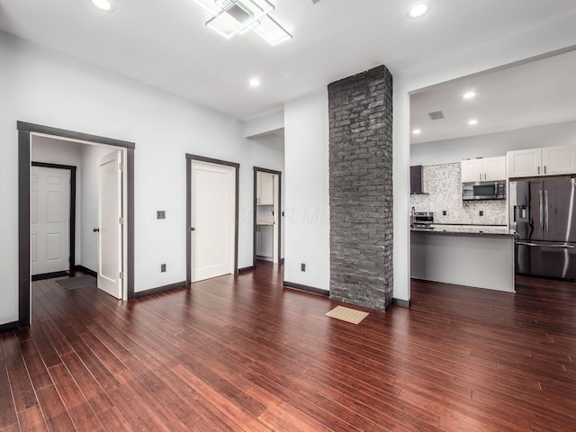 241 N 17th St, Columbus, OH 43203 - unfurnished living room with dark wood-style floors and recessed lighting