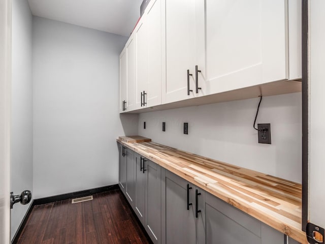 241 N 17th St, Columbus, OH 43203 - bar with dark wood-type flooring and baseboards