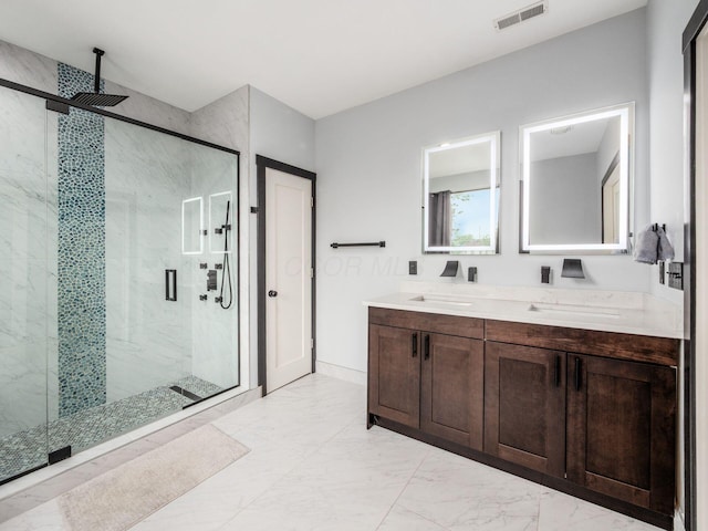 241 N 17th St, Columbus, OH 43203 - full bathroom with marble look tile flooring, a marble finish shower, and double vanity
