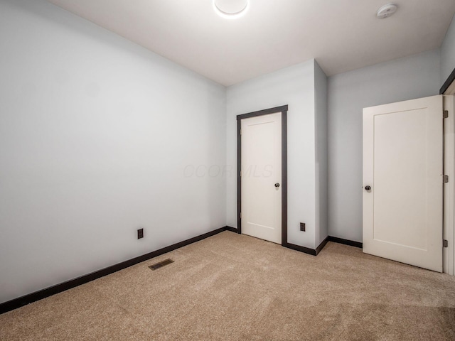 241 N 17th St, Columbus, OH 43203 - unfurnished bedroom featuring light colored carpet and baseboards