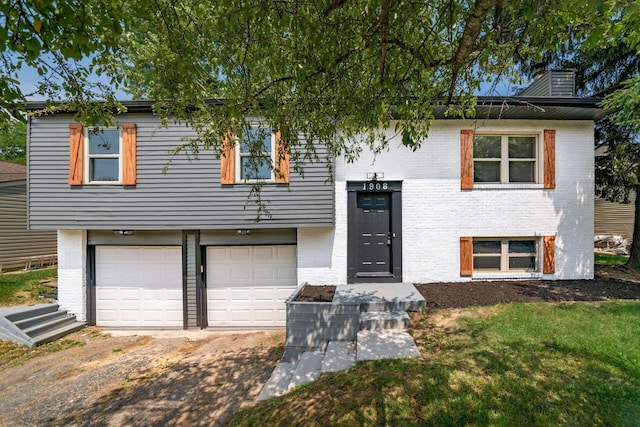 1908 Lost Valley Rd, Powell, OH 43065 - raised ranch featuring brick siding, an attached garage, and a chimney