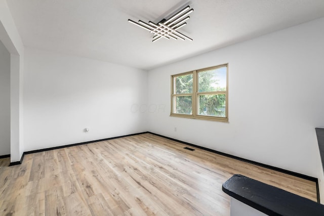 1908 Lost Valley Rd, Powell, OH 43065 - empty room with wood finished floors and baseboards