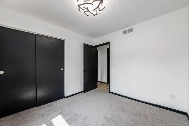 1908 Lost Valley Rd, Powell, OH 43065 - unfurnished bedroom with carpet floors, a closet, and a textured ceiling