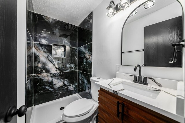 1908 Lost Valley Rd, Powell, OH 43065 - bathroom with vanity, a walk in shower, and a textured ceiling