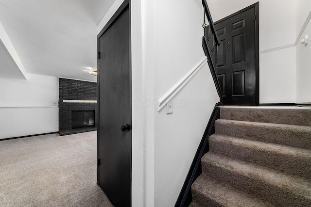 1908 Lost Valley Rd, Powell, OH 43065 - stairs with carpet flooring and a fireplace