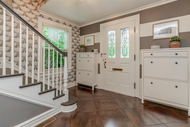 233 Preston Rd, Columbus, OH 43209 - entryway with ornamental molding and dark tile patterned flooring