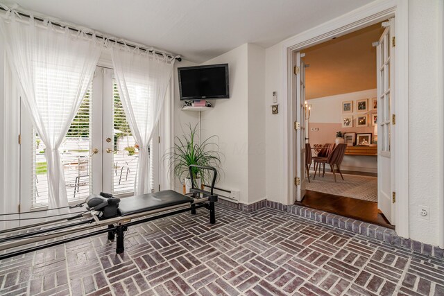 233 Preston Rd, Columbus, OH 43209 - exercise room with french doors, brick floors, and a baseboard heating unit