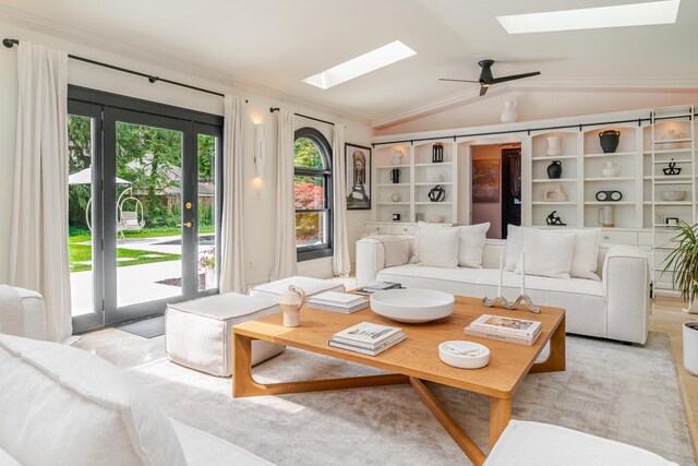 233 Preston Rd, Columbus, OH 43209 - living area with a skylight, lofted ceiling, ornamental molding, and ceiling fan