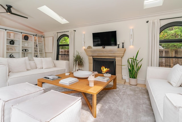 233 Preston Rd, Columbus, OH 43209 - living area featuring healthy amount of natural light, a ceiling fan, lofted ceiling, ornamental molding, and a skylight