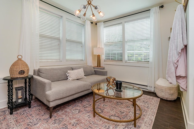 233 Preston Rd, Columbus, OH 43209 - living area with wood finished floors, a chandelier, and a baseboard radiator